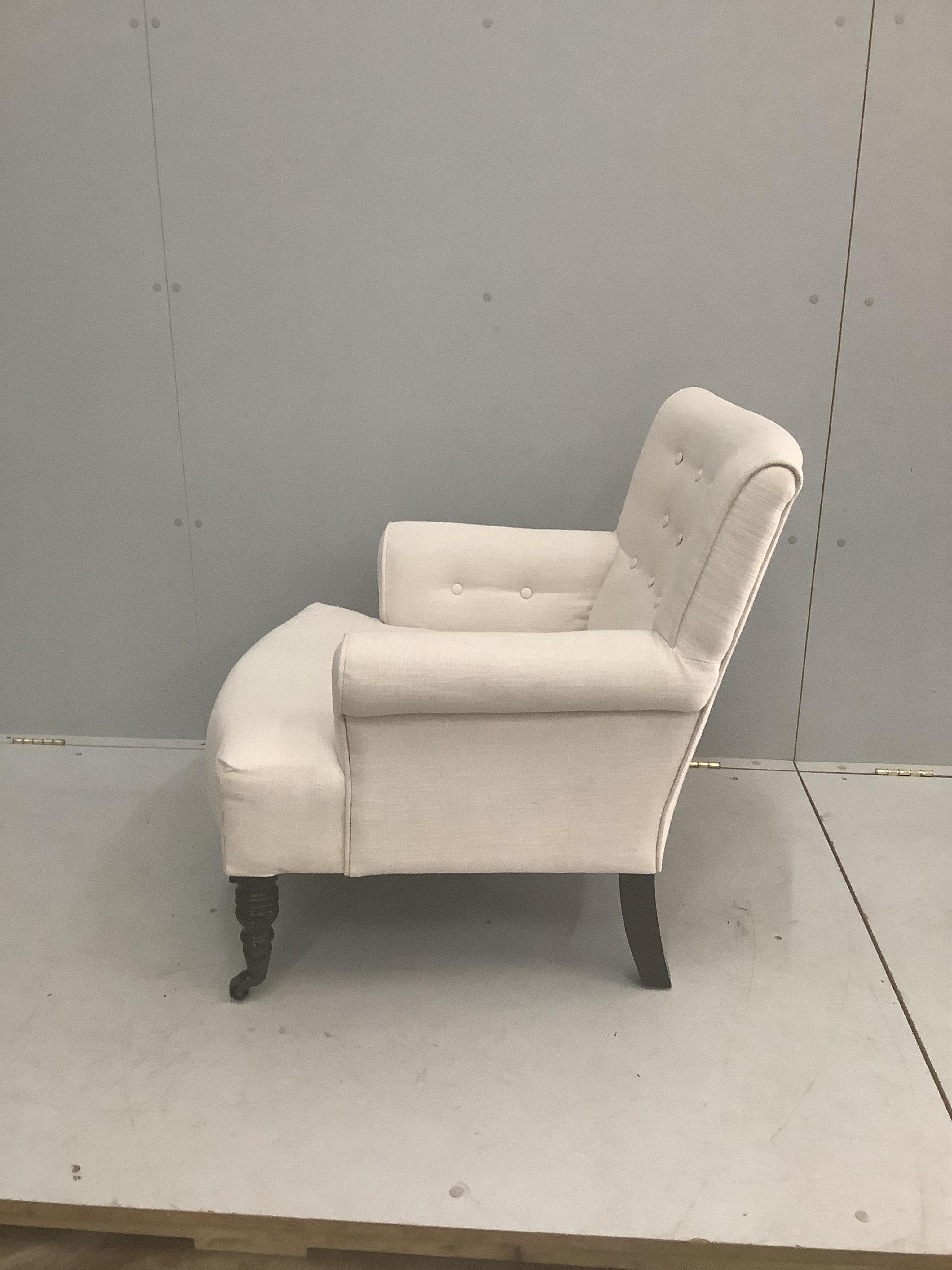 A modern Victorian style upholstered armchair, width 72cm, depth 70cm, height 76cm. Condition - fair